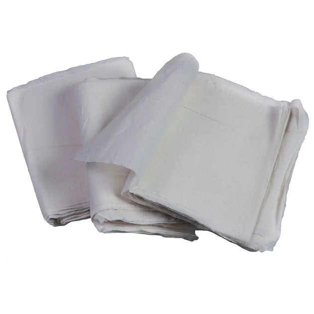 Stack of white fabric sheets on a white background