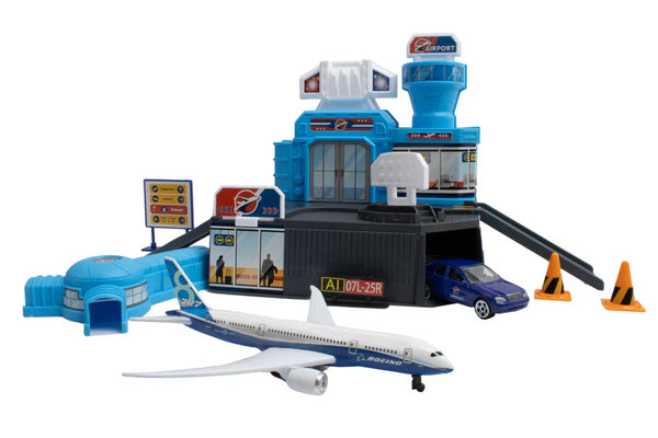 Toy airport set with airplane, terminal, and vehicles on a white background
