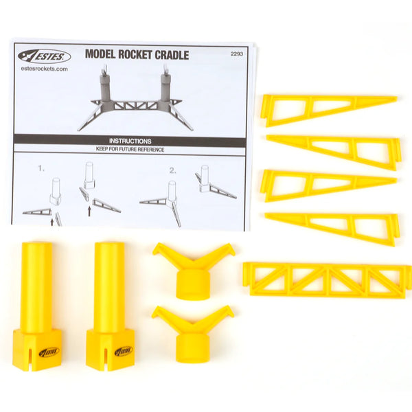 Yellow model rocket cradle parts and instructions on a white background