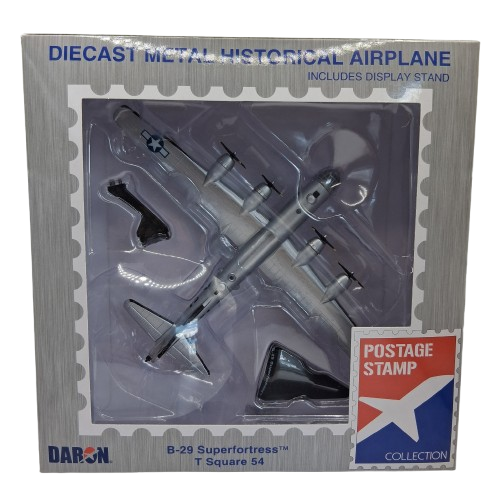Boxed diecast metal historical airplane model with display stand and postage stamp collection label.