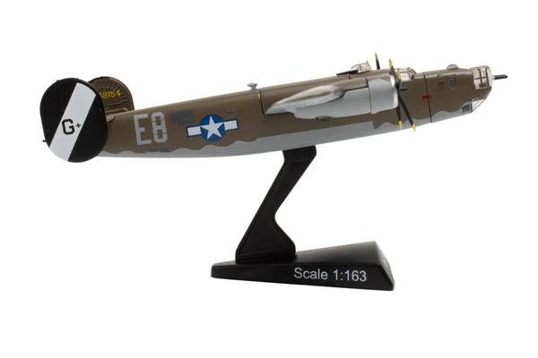 Model airplane on a stand with a white background