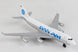 Model airplane with Pan Am logo on a gray background