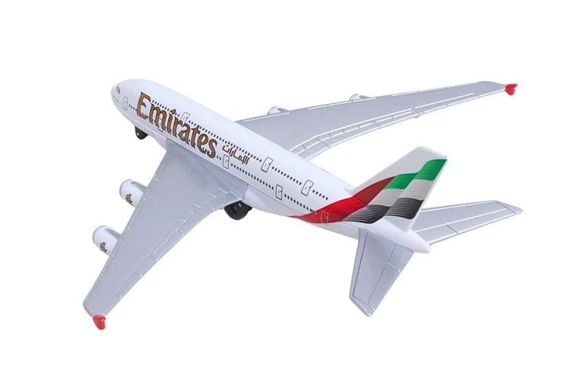 Model airplane with Emirates branding on a white background