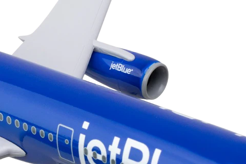 Close-up of a jetBlue airplane with a focus on the logo.