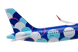Model airplane with colorful design on a white background