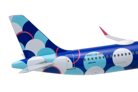 Model airplane with colorful design on a white background