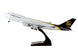 Model airplane with UPS logo on a white background
