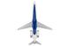 A top-down view of a model airplane, likely a toy or scale model, featuring a white fuselage, blue nose and underbelly, and gray wings and engines, isolated on a white background.