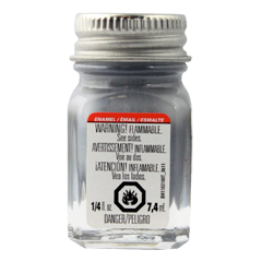 A bottle of Testors gloss gray enamel paint in a 1/4 oz glass container with a white cap.