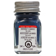 A bottle of Testors TES1172TT Flat Sea Blue Enamel Paint with a label indicating the color and a warning of flammability.