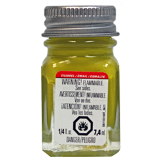 A bottle of Testors Flat Zink Chromate Enamel Paint in yellow color with a label and cap.