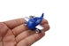 Blue airplane keychain with 'jetBlue' branding held in a hand against a white background