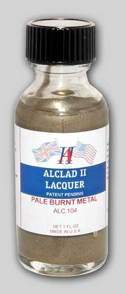 A bottle of Alclad II Pale Burnt Metal Lacquer Paint with a label showing the product name and metal color.
