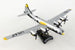 A die-cast metal model of the Postage Stamp B-29 Superfortress 'HAWG WILD' in 1/200 scale with a plastic stand, featuring the aircraft's markings and approximately 6 inches in length with an 8 1/8 inch wingspan.