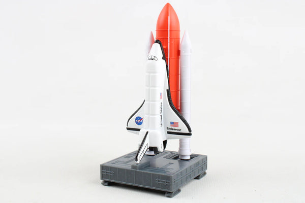 Model of a space shuttle and rocket on a white background