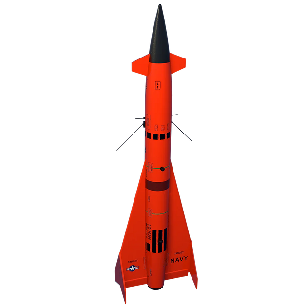 Model rocket with orange body and black nose cone on a white background