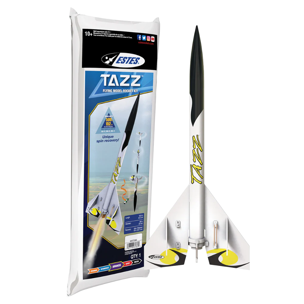 A Estes Tazz rocket model kit shown next to its retail packaging on a plain white background. The rocket is white with black upper fins and yellow accents, and the packaging features the Estes brand logo and product details.
