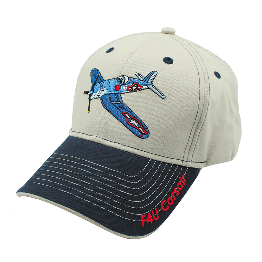 A beige and navy blue baseball hat with a embroidered F4U Corsair aircraft on the front.