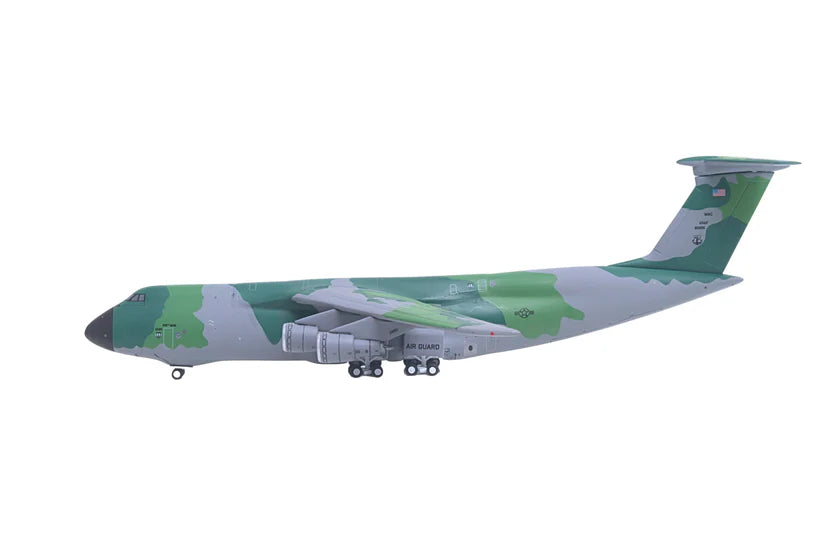 Model of a military transport aircraft with camouflage design on a white background