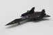 A black U.S. Air Force model jet model airplane on a light gray textured background.