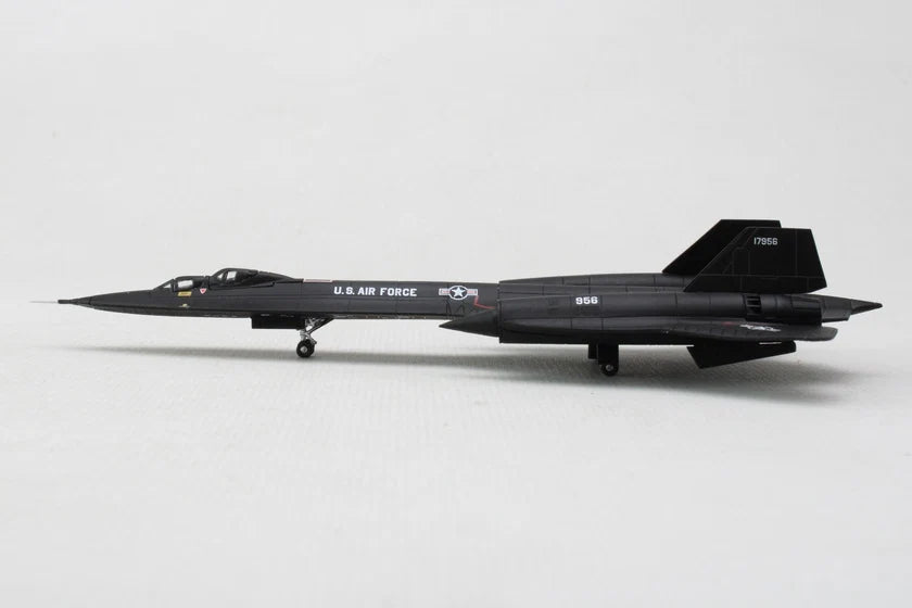 A scale model of a black U.S. Air Force SR-71A Blackbird jet, shown from a side profile view on a light gray background.