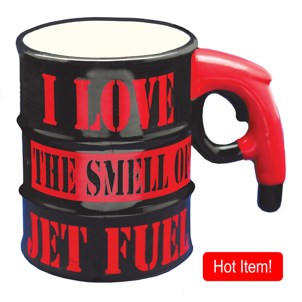 A black coffee mug with red text and design featuring the phrase 'I love the smell of jet fuel' and a handle resembling a gas pump.