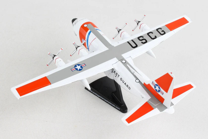 Model of a USCG aircraft with red and white colors on a gray background