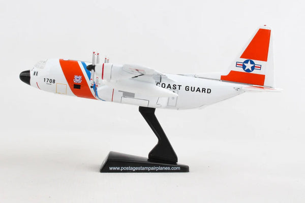 Model airplane with Coast Guard markings on a white background