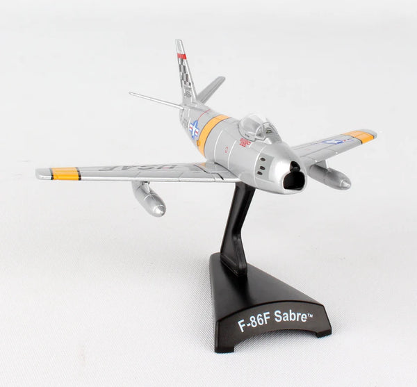 Model of an F-86F Sabre airplane on a white background
