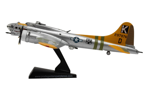 Model airplane with a silver body, yellow wings, and black tail on a white background.
