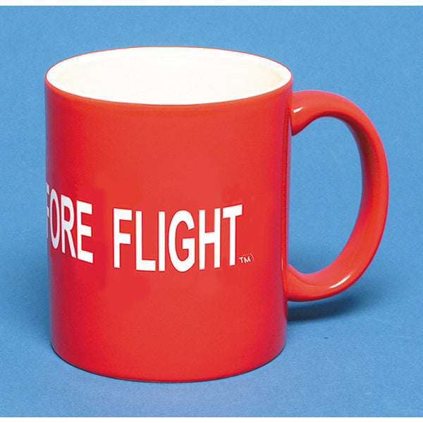 red airplane coffee mug with remove before flight