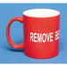 A red ceramic coffee mug with the text 'REMOVE BEFORE FLIGHT' in white capital letters.