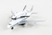 A diecast model toy of a United States Space Shuttle attached to a white and blue Boeing 747 passenger aircraft, photographed on a light gray background.