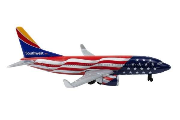 Model airplane with Southwest Airlines logo and American flag design on a white background
