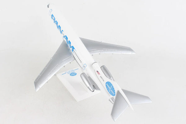 Model airplane with blue and white design on a light gray background