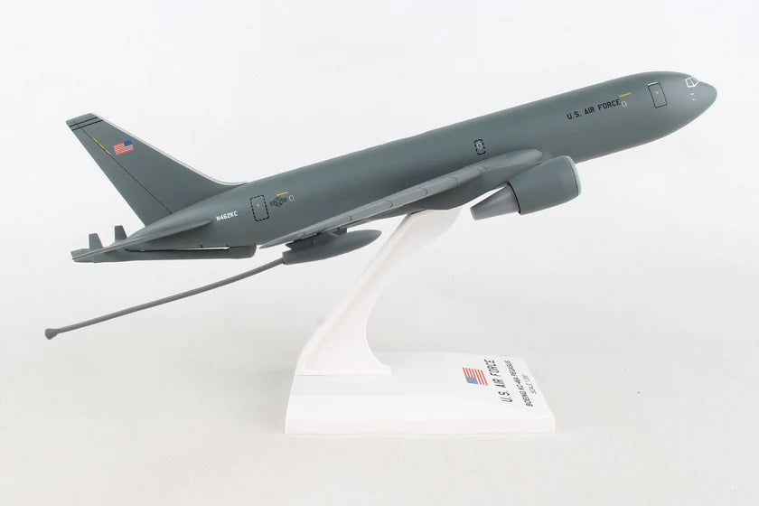Model of a military aircraft on a white stand with a visible brand name.