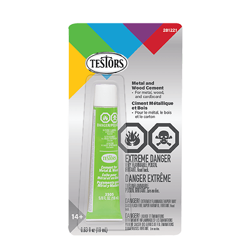 Testors Metal and Wood Cement in a 10 ml tube, packaged in its original retail blister card. The packaging features a white background with a colorful gradient header (green, yellow, blue, purple, red) and black warning labels.