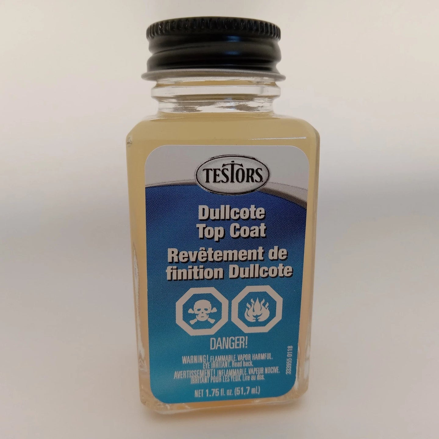 Testors Dullcote Top Coat jar on a white background