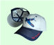 A two-tone embroidered hat with a Corsair aircraft design on the front and 'F4U CORSAIR' text on the brim.